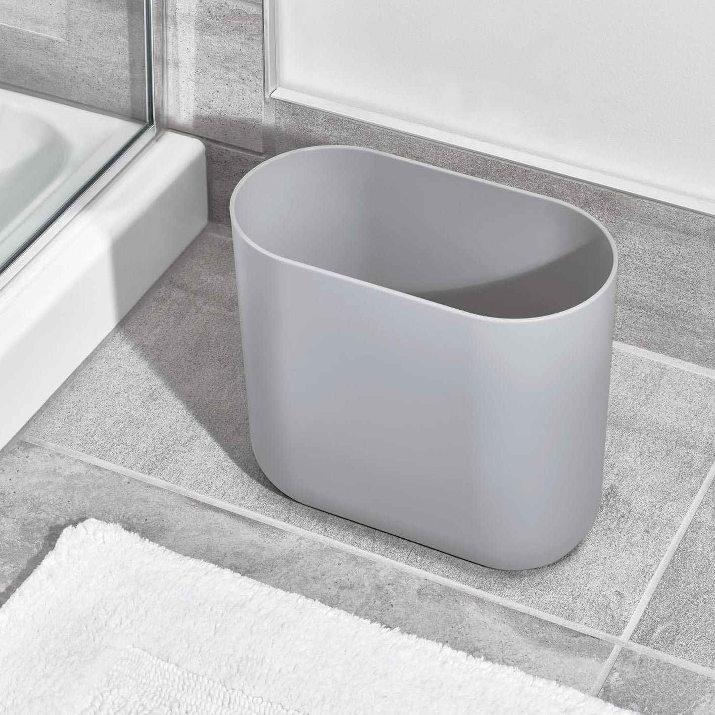 iDesign Cade Oval Slim Trash, Compact Waste Basket Garbage Can for Bathroom, Bedroom, Home Office, Dorm, College, Matte Gray